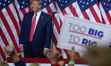 Trumps zodiac sign - Donald Trump at a campaign smiling.