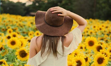 Saturn in Aries - Woman in Sunflower field.